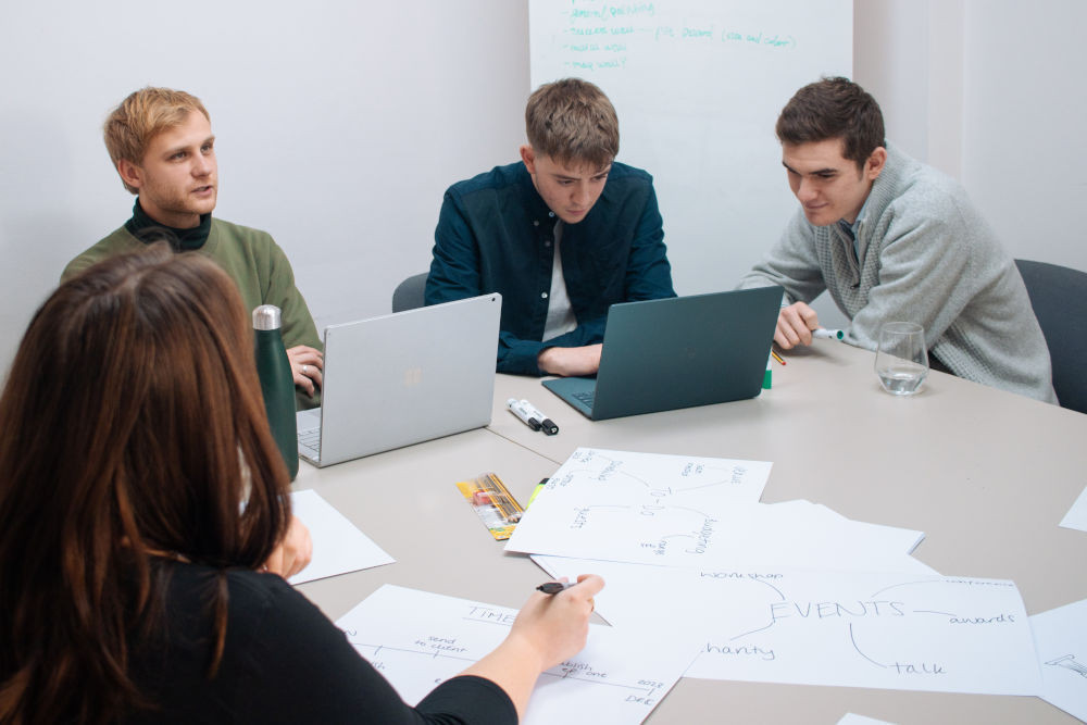 Creative team discussing around a table